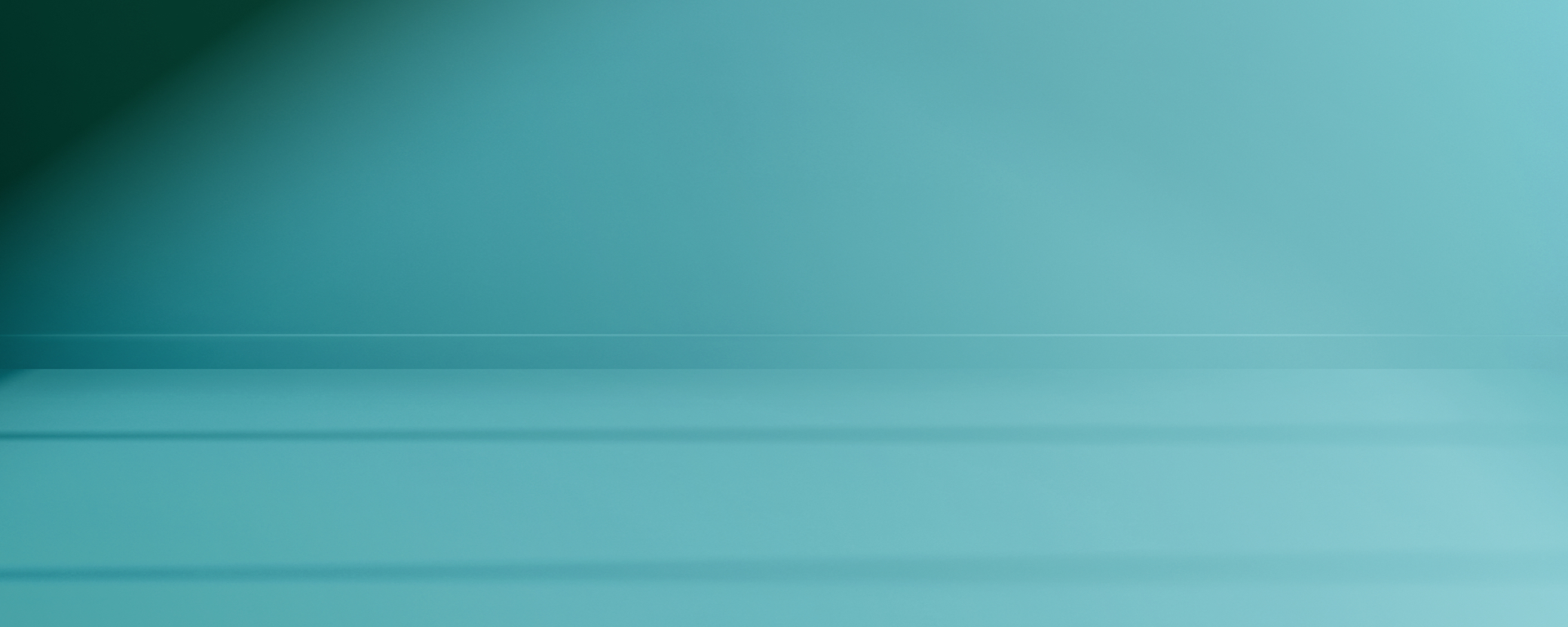 Blank wall in a light blue aqua colour