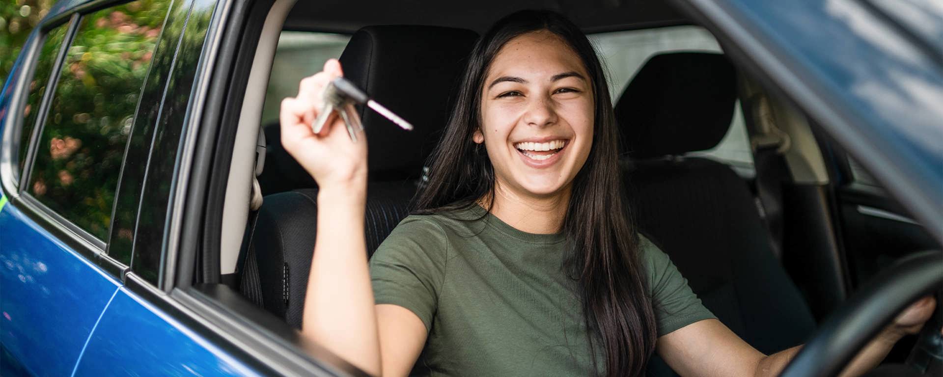 Instant Finance Car Loan. Woman holding keys to new car