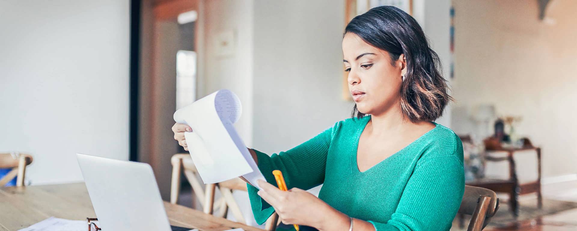 Instant Finance Debt Consolidation Loan. Woman holding a piece of paper and pen