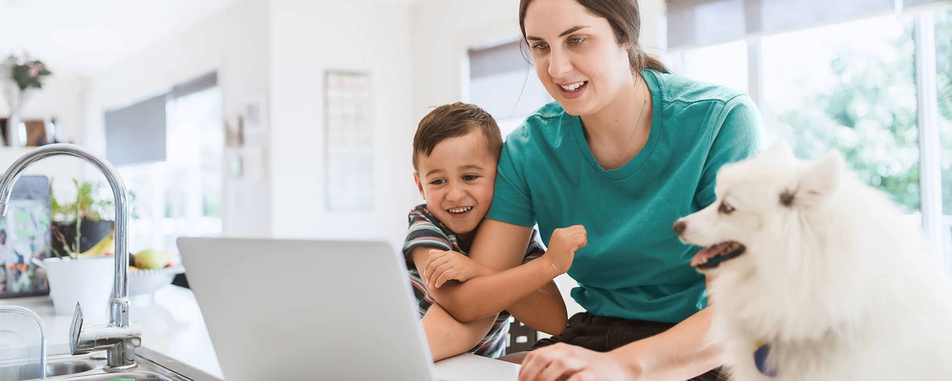 Instant Finance How to get a loan. Woman with son and dog looking at a laptop computer