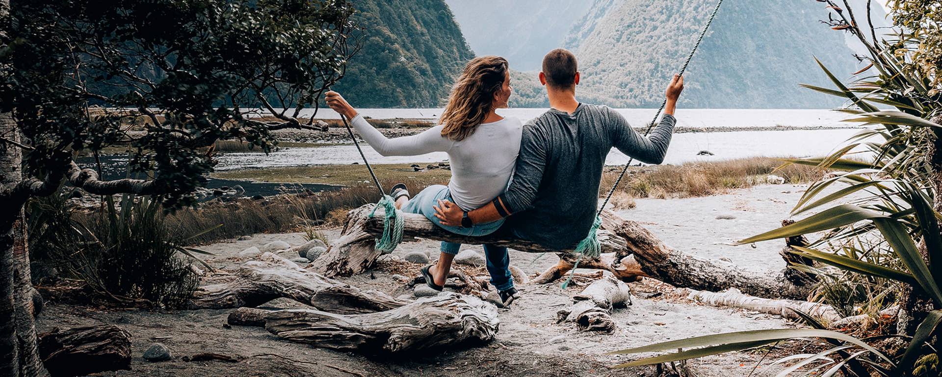 Instant Finance Personal Loans. Man and Woman on a Swing