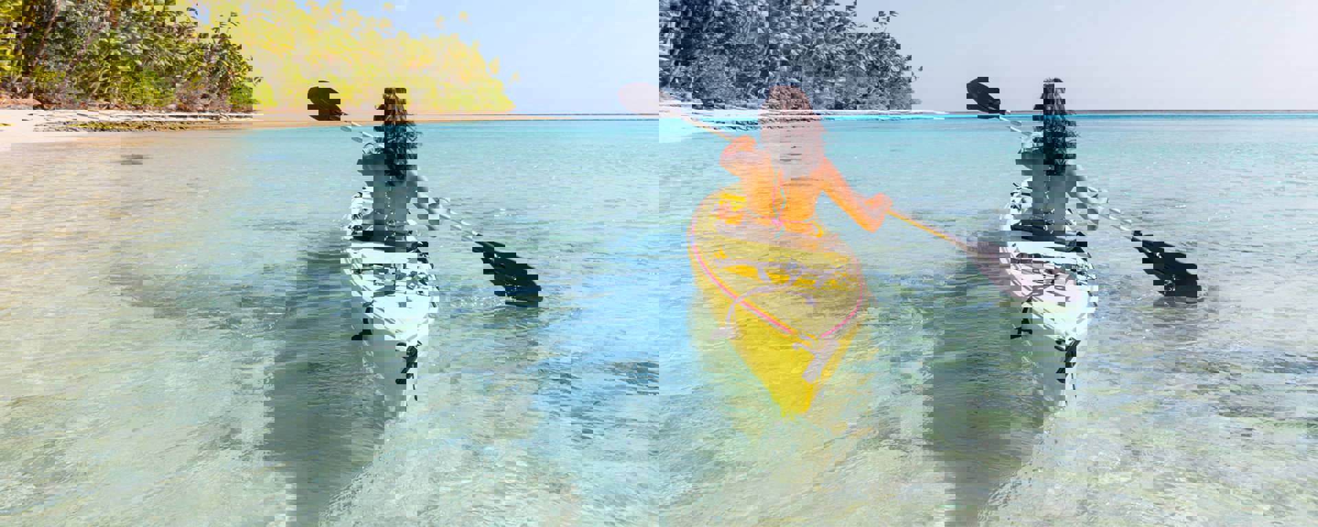 Instant Finance Travel Loan. Woman paddling a canoe