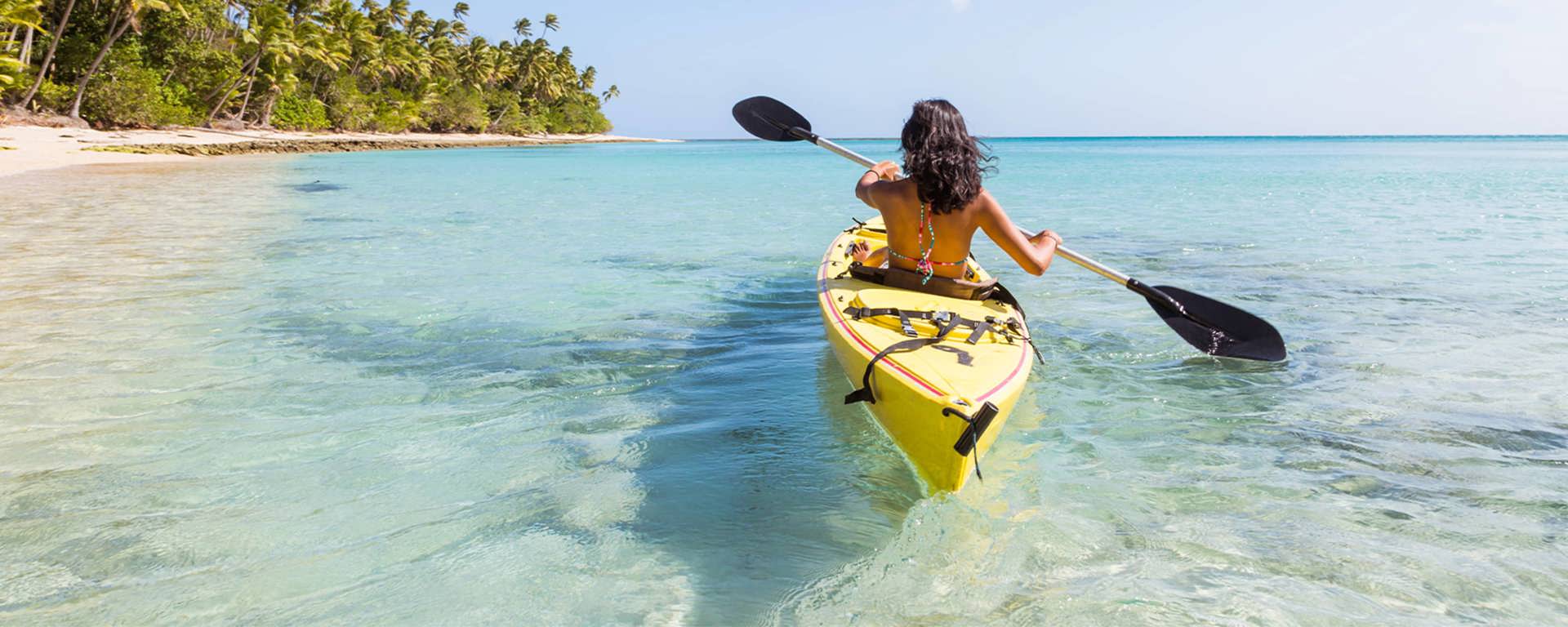 Instant Finance Travel Loan. Woman paddling a canoe