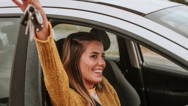 Instant Finance Personal Loans. Woman Holding Car Keys. Personalised Interest Rates