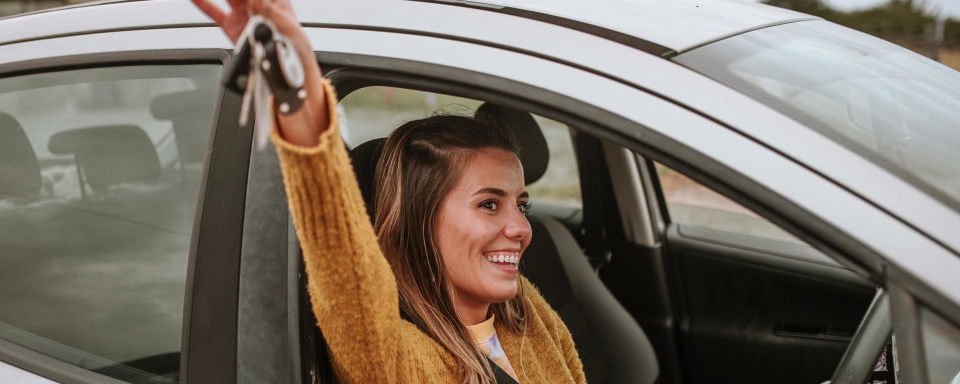 Instant Finance Personal Loans. Woman Holding Car Keys. Personalised Interest Rates